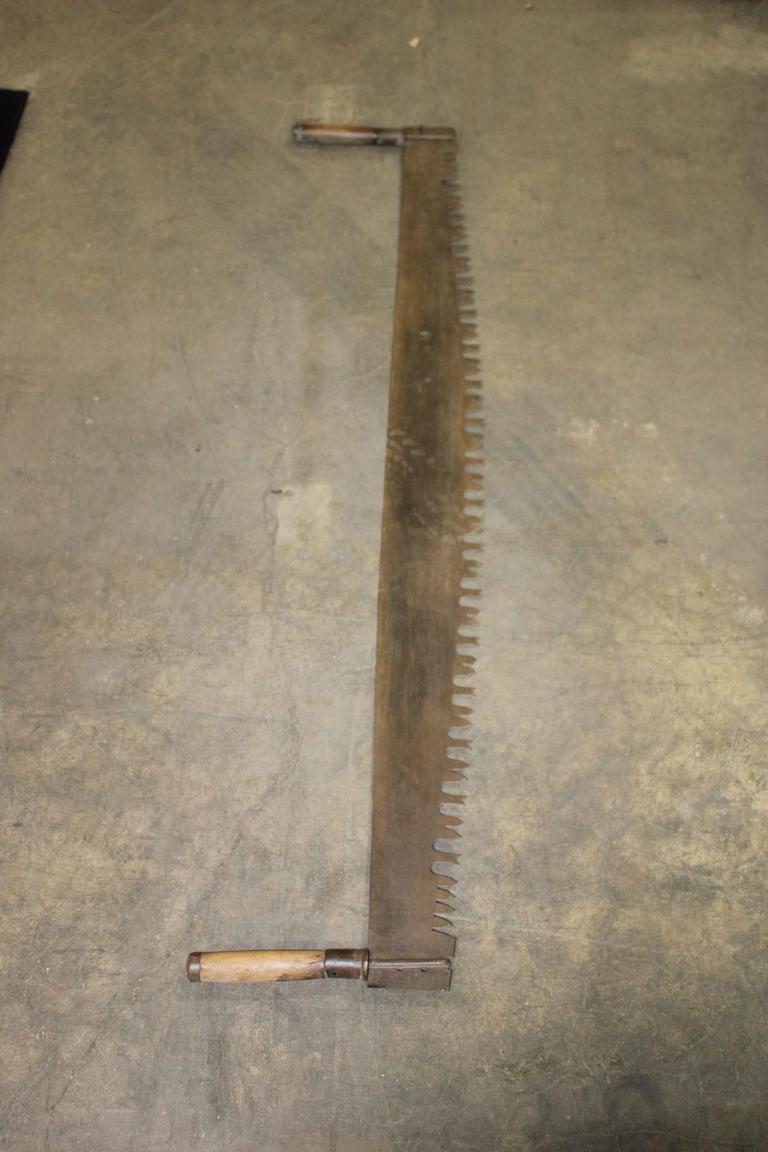 Two man deals buck saw